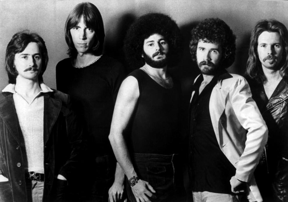 The five members of Boston posing together in 1976