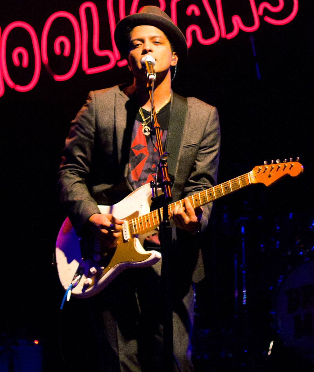 Bruno Mars in a hat performing in Houston in 2010