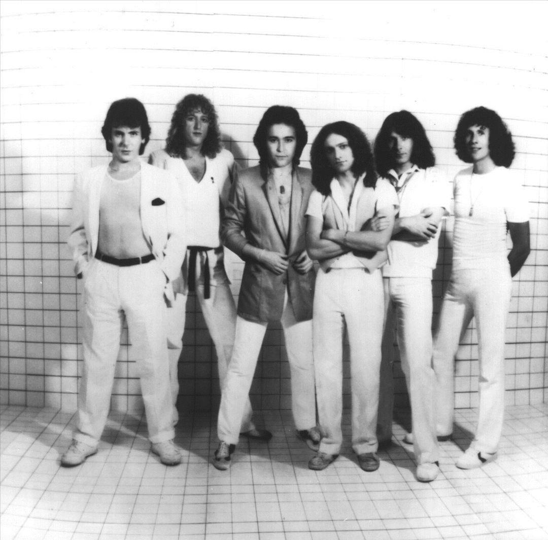 The six members of Foreigner posing together in 1979