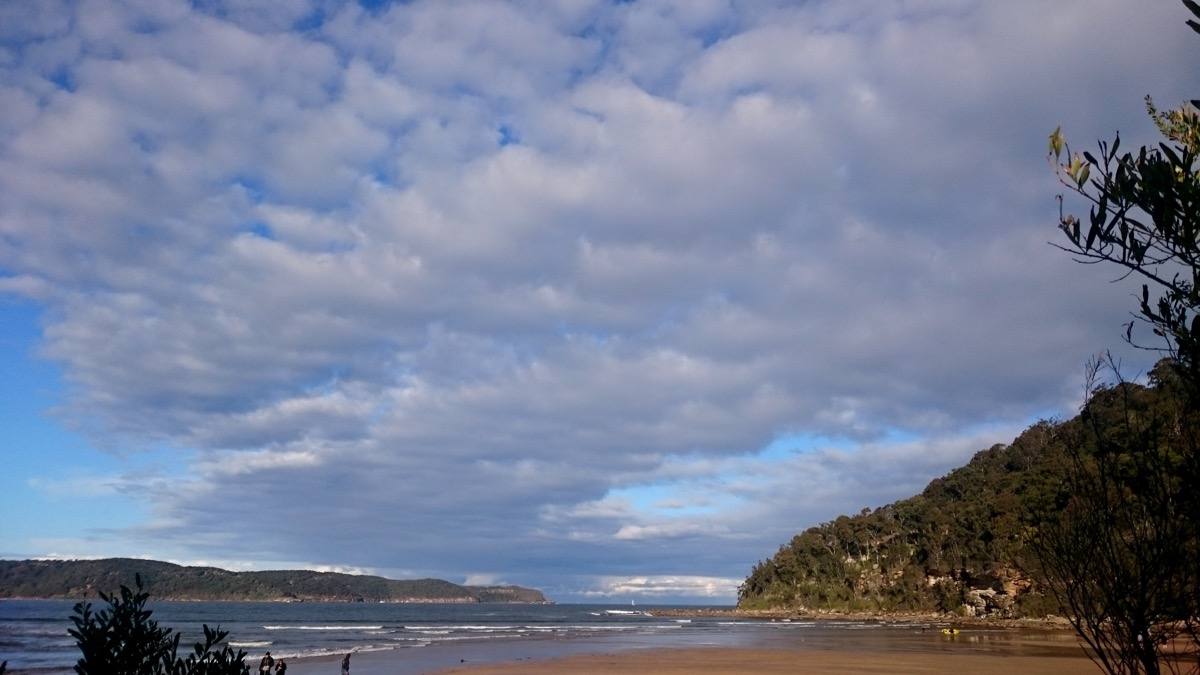 The sand and surf of Umina Beach on the Central Coast