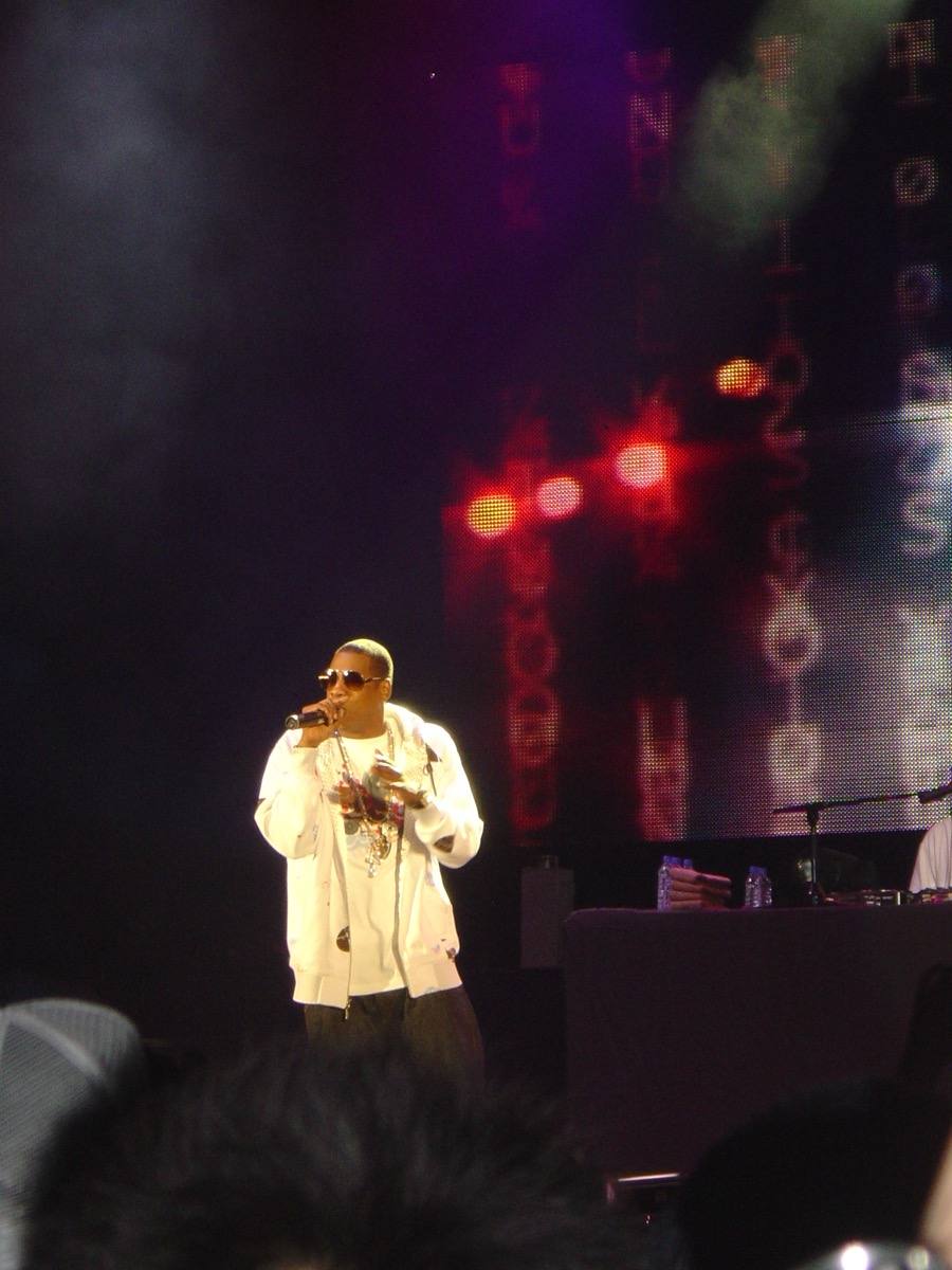 Jay-Z performing on a stage with a microphone in 2006
