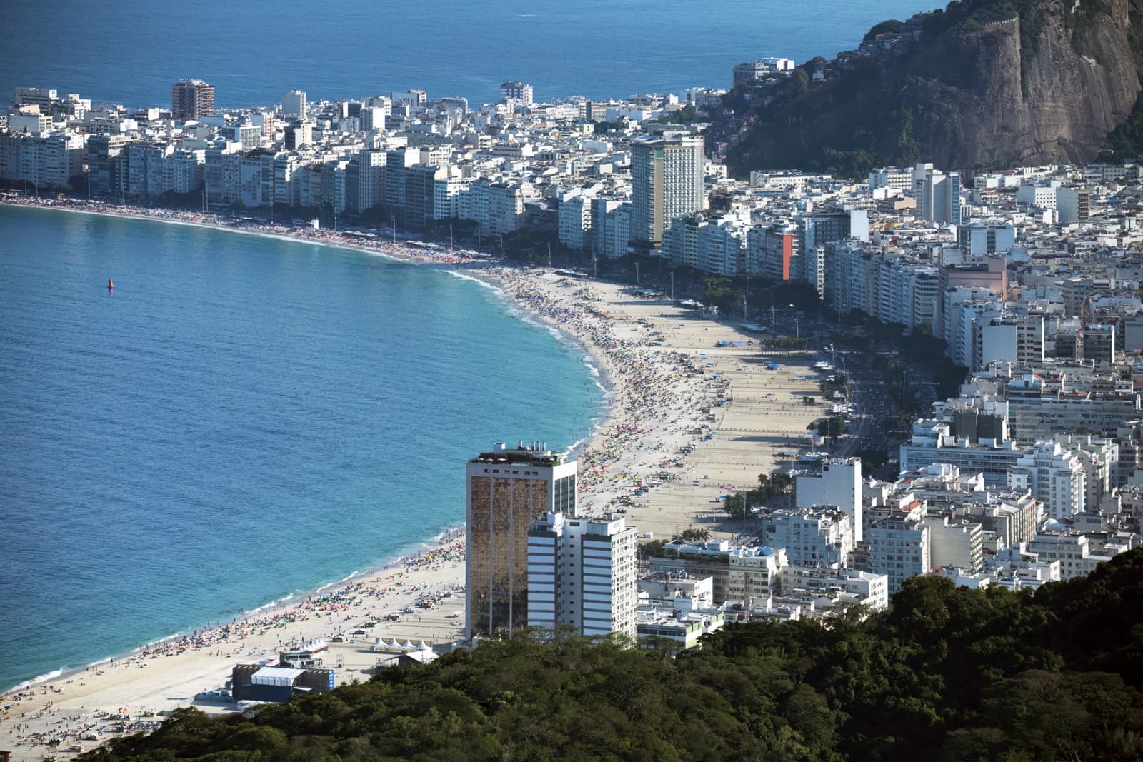 The long curve of Copacabana beach and its apartment blocks