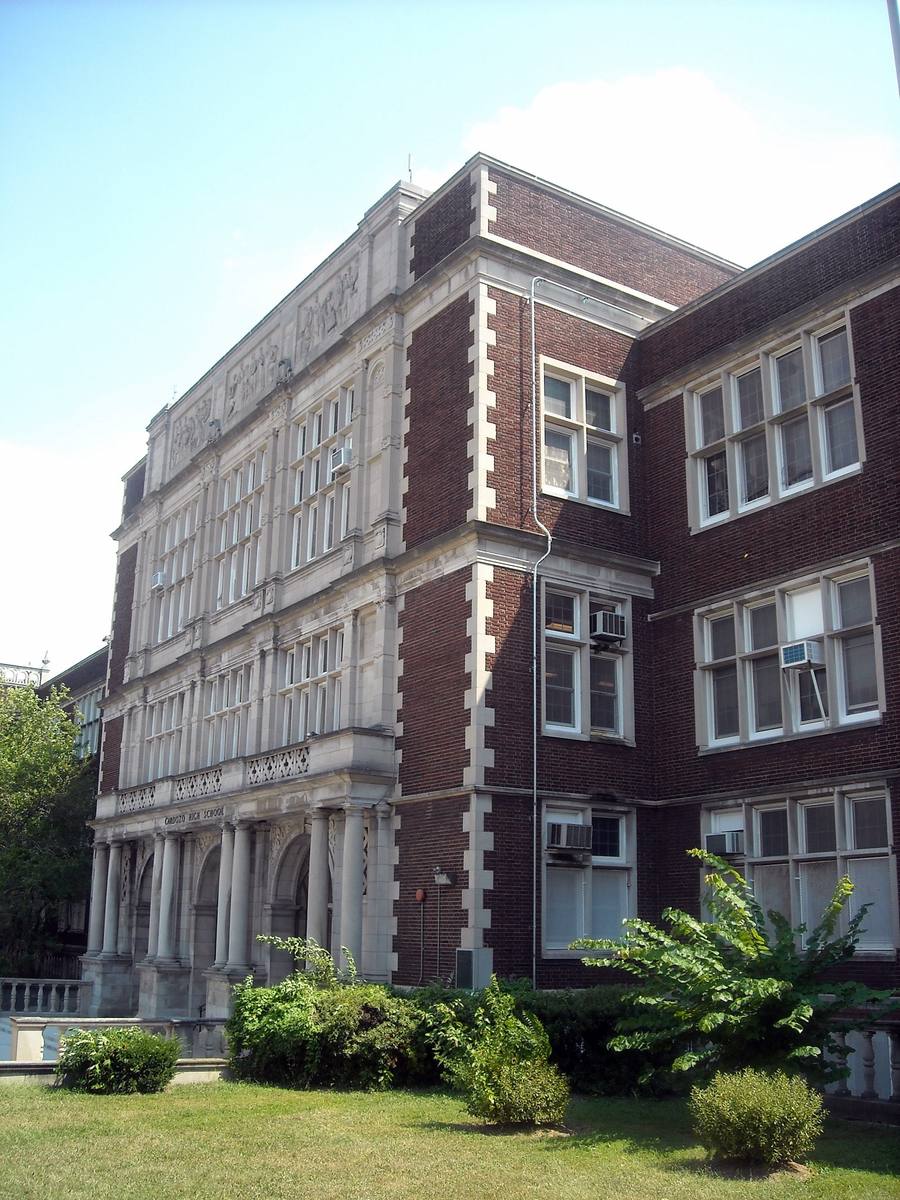 The tall red-brick and stone front of Cardozo High School