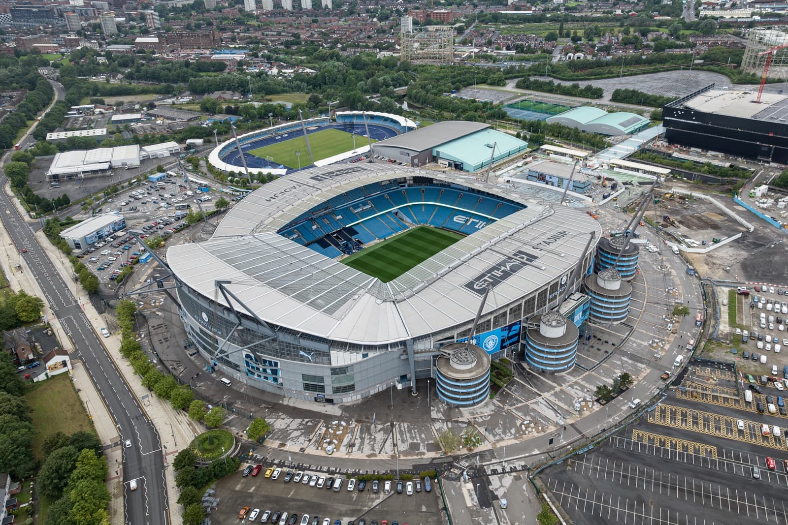 Aerial view of a stadium ringed with masts