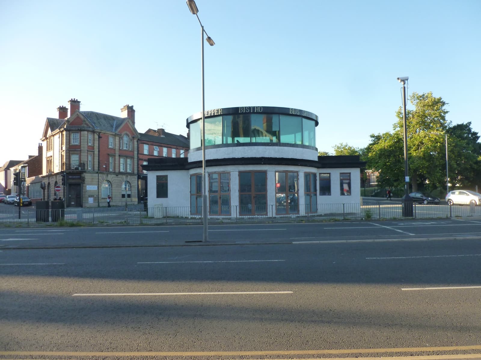 A low shelter building on a roundabout island
