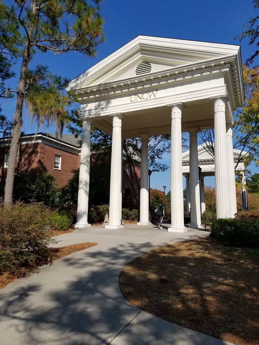 Brick arches and a lawn on the UNC Wilmington campus