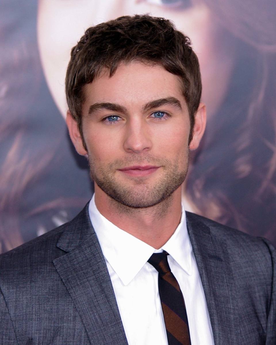 Chace Crawford in a grey suit and striped tie