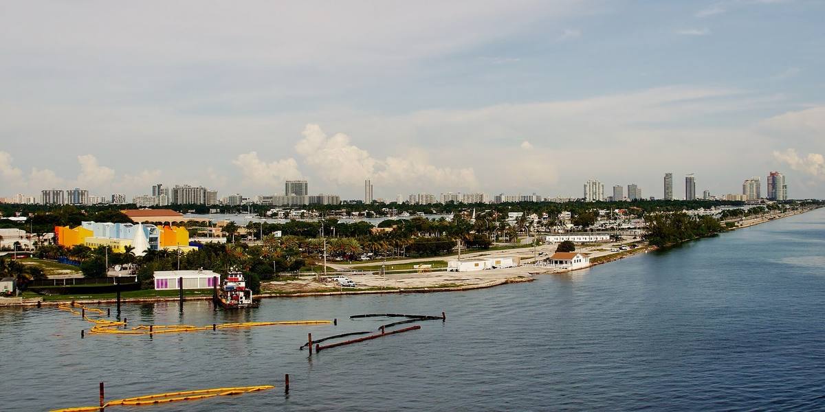 Calm bay water beside Watson Island with Miami Beach on the horizon