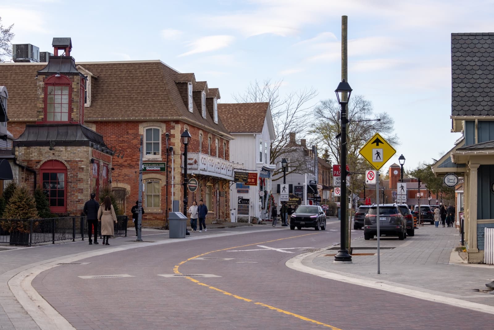 Brick shopfronts and a curving historic main street in Unionville