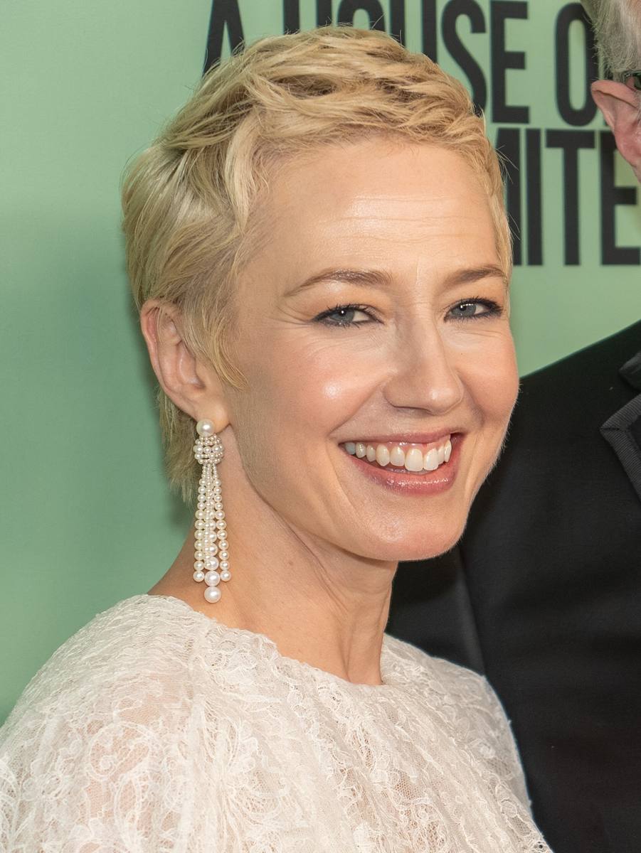 Carrie Coon smiling, hair swept back
