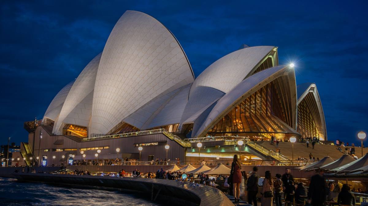 The white sail roofs of the Sydney Opera House on the harbour