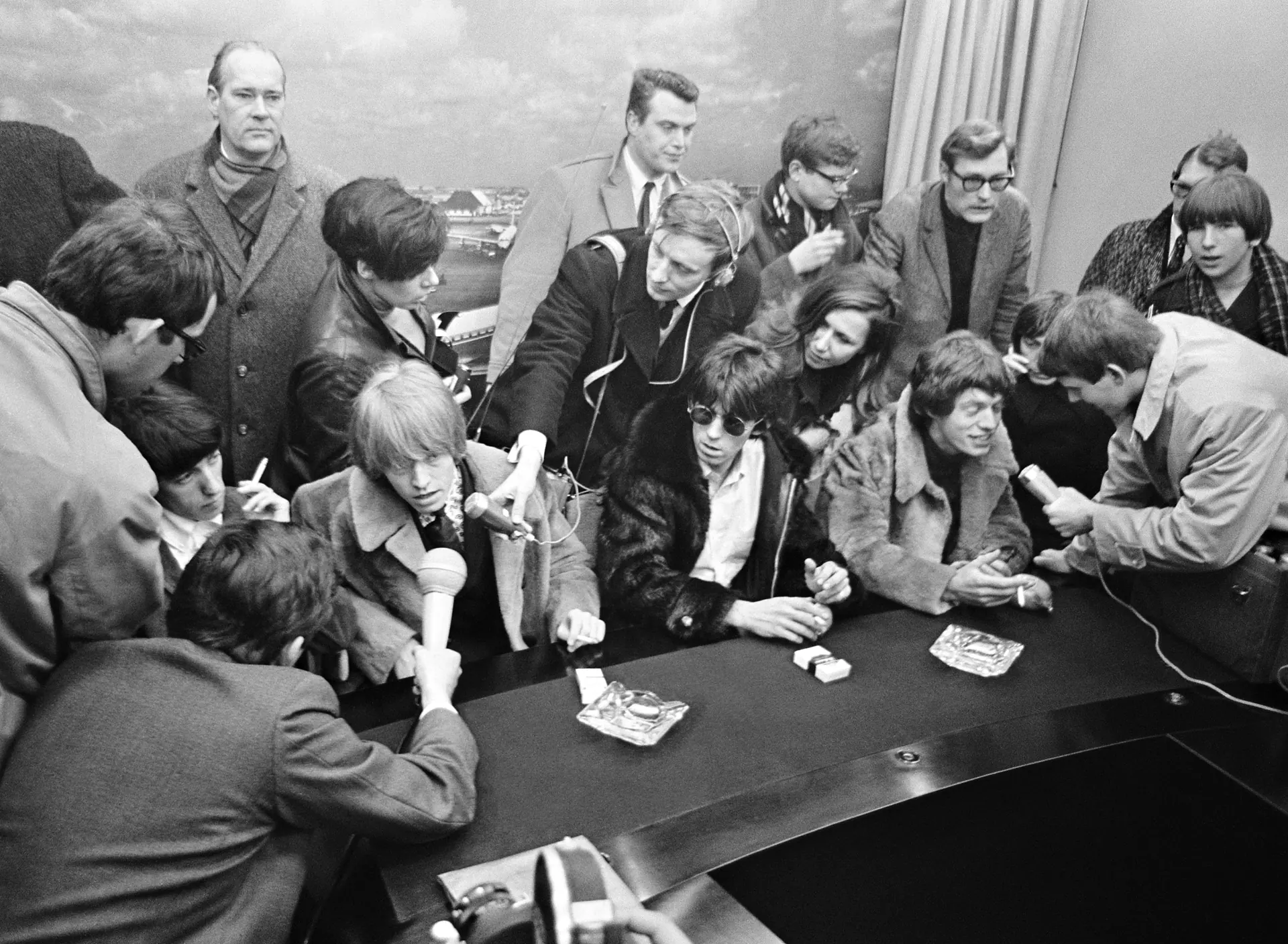 The Rolling Stones surrounded by press in 1966