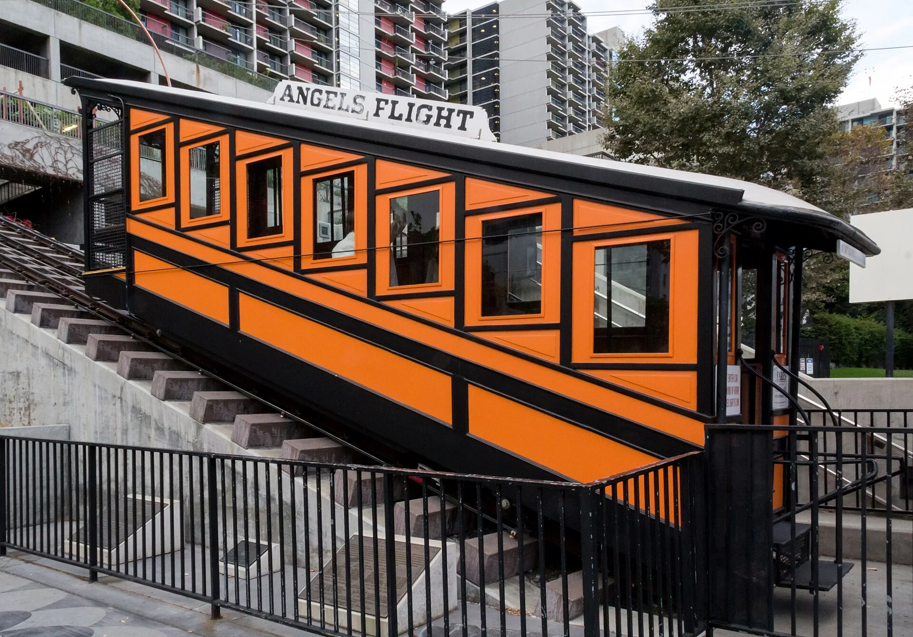 An orange Angels Flight funicular car on the hillside railway.
